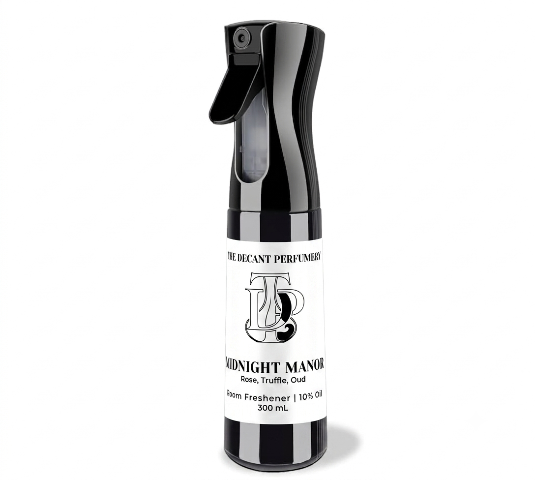 A 300 mL room freshener spray bottle by The Decant Perfume, featuring a black plastic bottle and sprayer with a white paper label. The label displays the brand logo and the scent name 'Midnight Manor' on a clean white background.