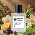 Perfume bottle labeled 'The Decant Perfumery' surrounded by flowers, fruits, and leaves on a wooden background