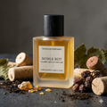 Perfume bottle labeled 'Noble Rot' by The Decant Perfumery with corks and dried fruits on a dark background.